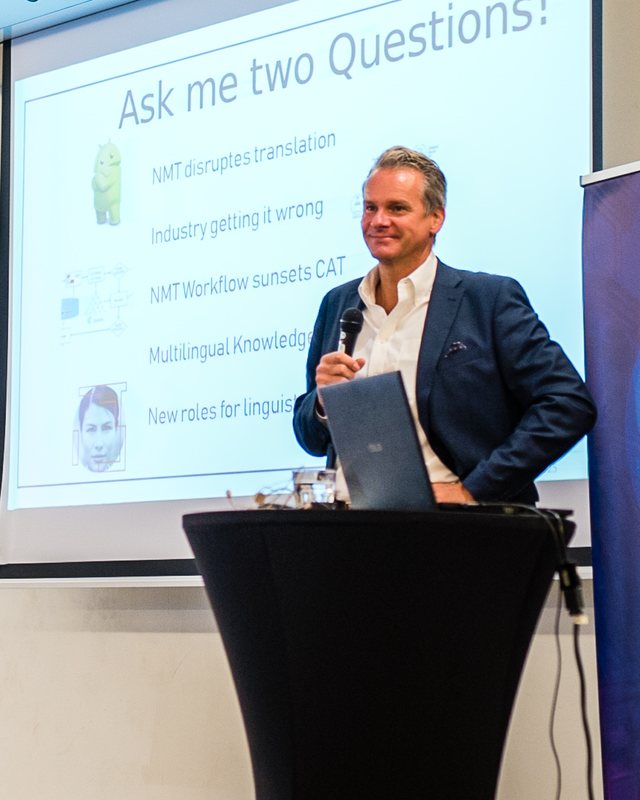 Jochen Hummel speaking at a lectern in 2019